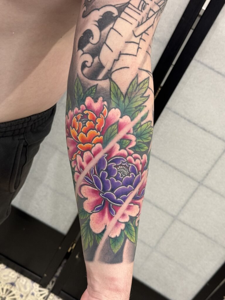 colorful japanese peony flower tattoo done by mangesh rane